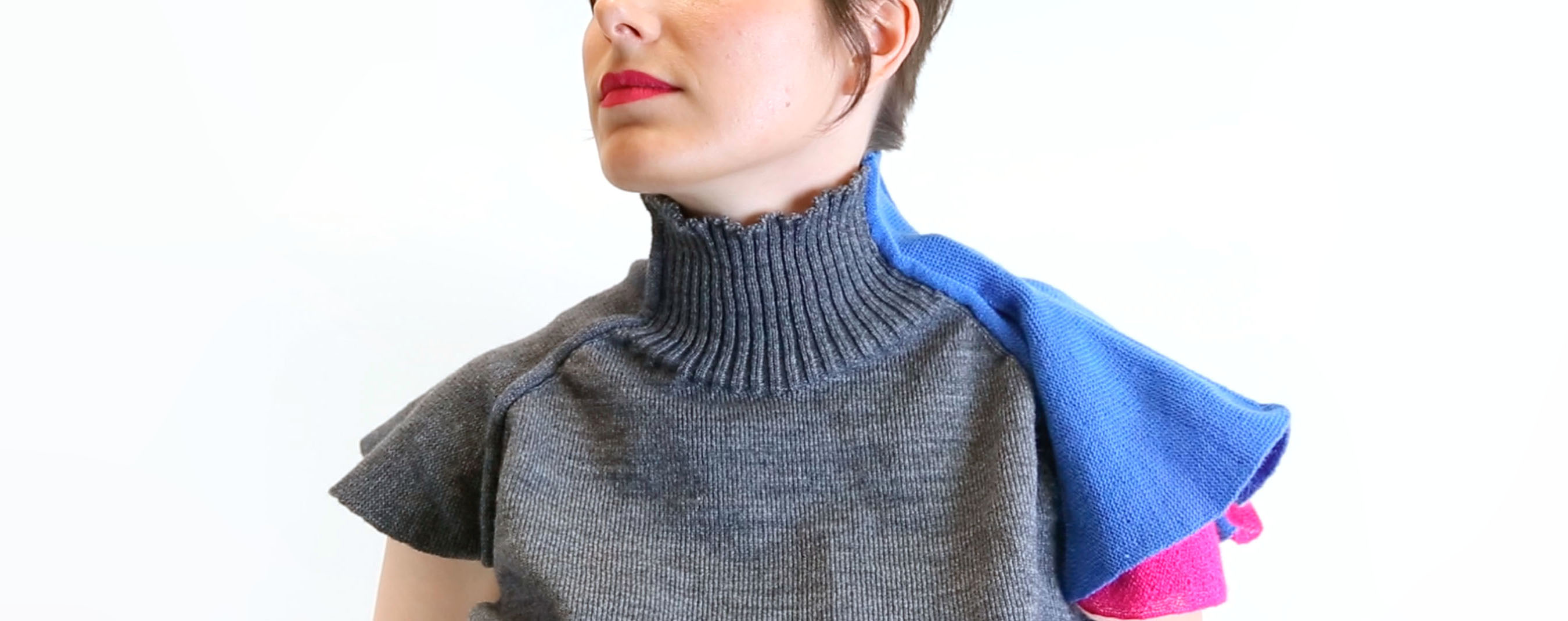 A sweater that can tap the wearer on the shoulder; before.